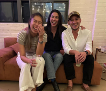 Three people laughing