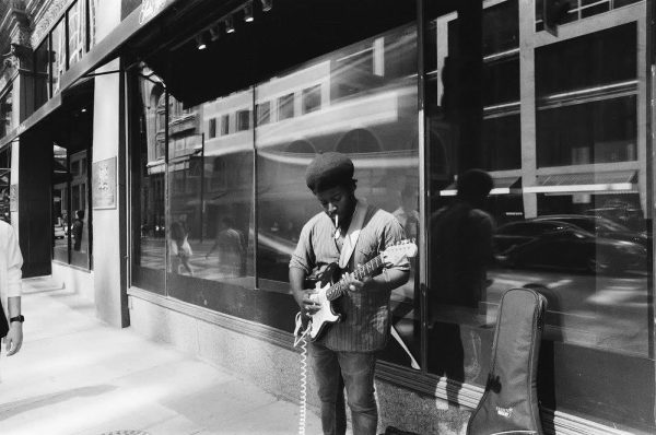 A blues artist busking on the streets of Toronto