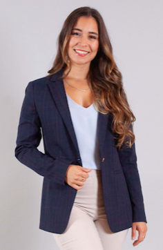 Daniella Montague, Founder, Osteopathic Health & Vitality Clinic in a blue blazer