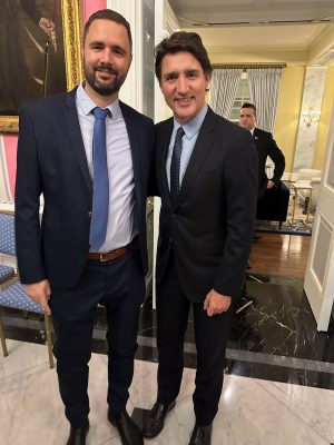 Two people standing together one of the is Canadian Prime Minister Justin Trudeau