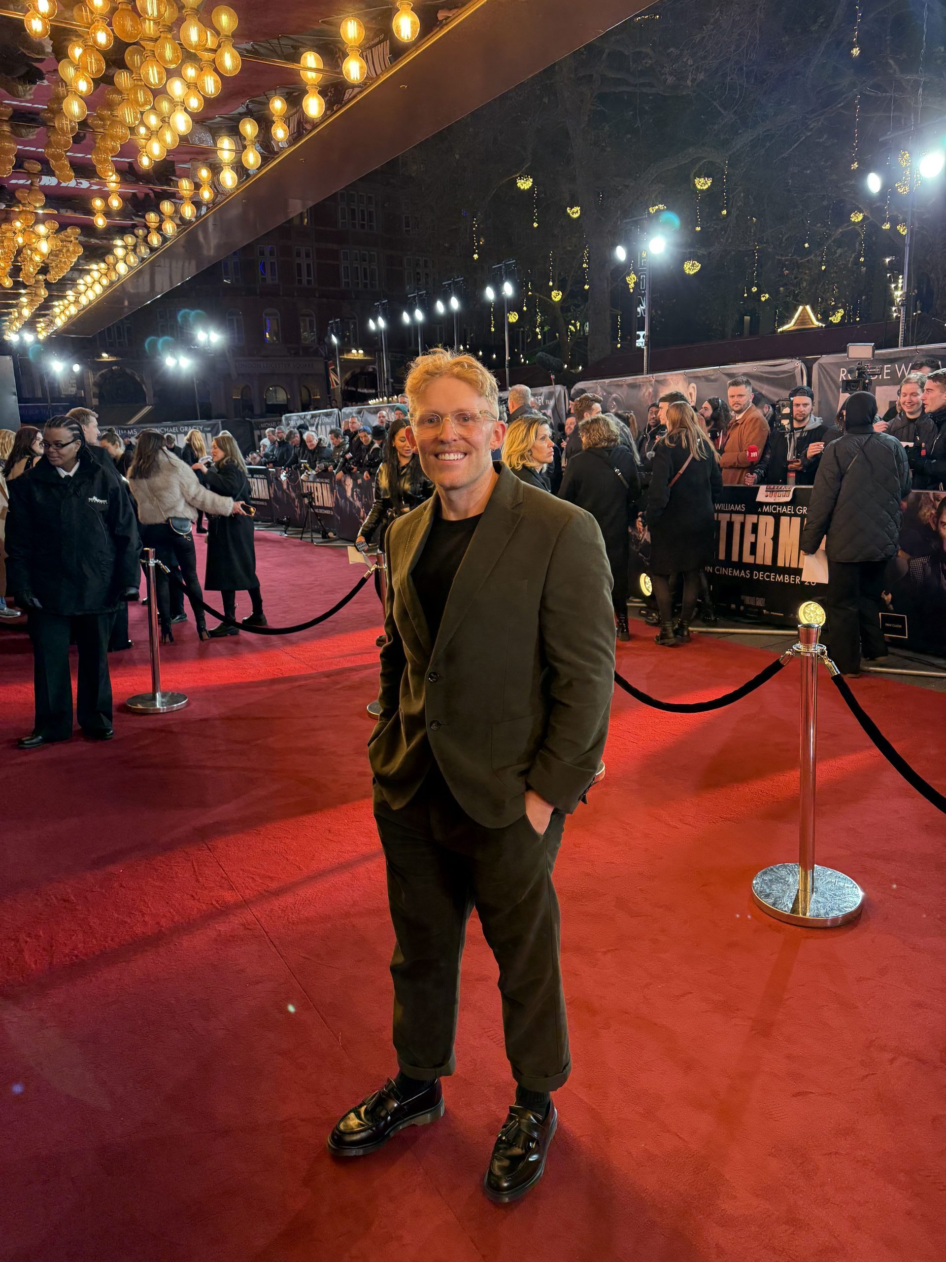 A Man standing on the RedCarpet of the movie premiere of Better Man 